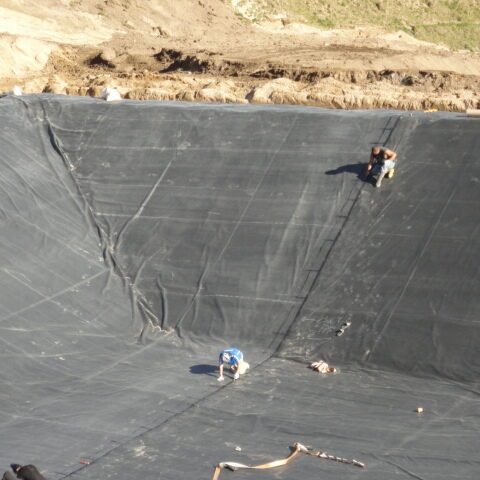 Dairy effluent pond liner being installed