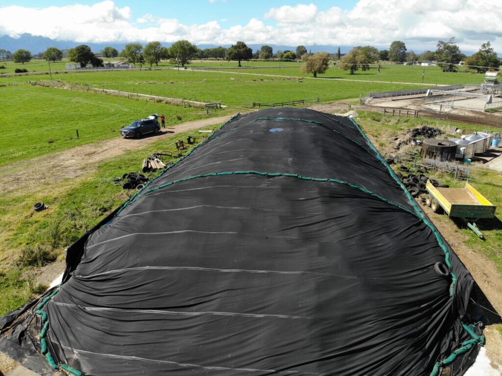 Photo of large silage stack covered with GeoSmart reusable silage cover.